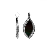 Sterling silver marquise pendant with black shell inlay and ornate Balinese carving, handcrafted in Bali.